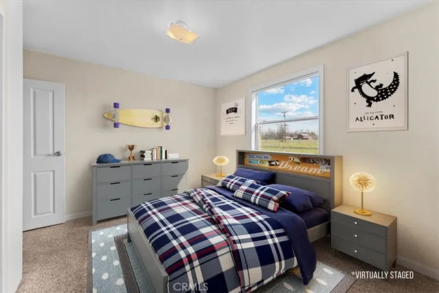 a living room with furniture and painting on the wall