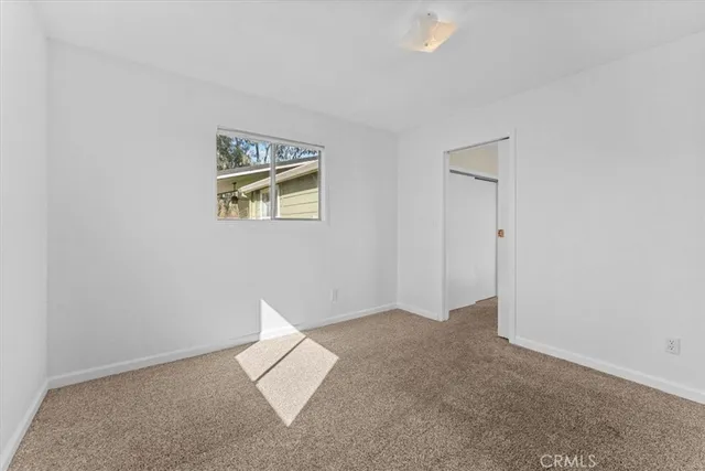 a front view of a house with a yard outdoor seating and garage