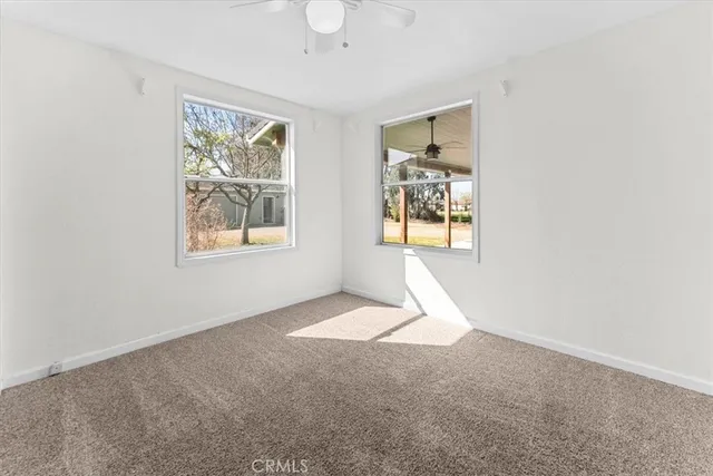 a view of a house with backyard and porch