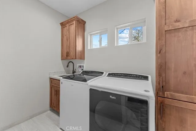 a view of backyard of house and garage