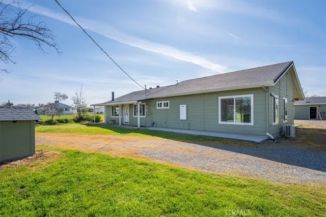 a view of a golf course with a lake view