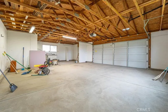 a view of a swimming pool with a bench and wooden fence