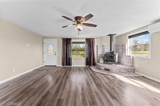a view of livingroom with hardwood floor and a ceiling fan