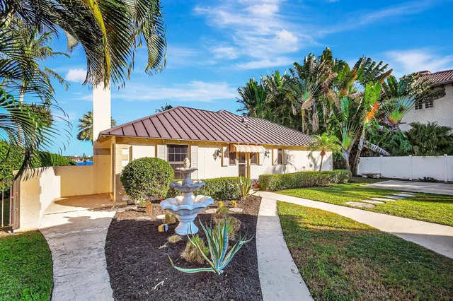 a kitchen with a refrigerator and white cabinets