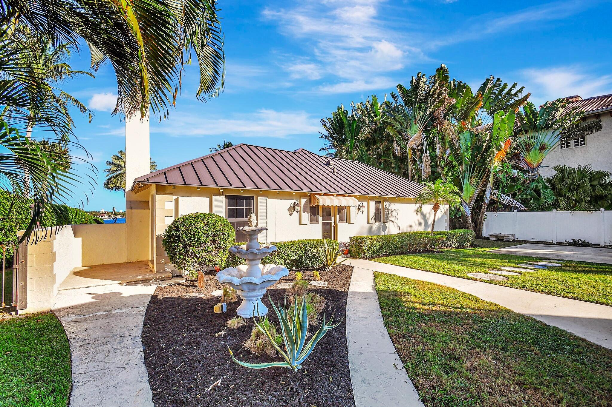 310 South Lake Drive Lantana, FL 33462 - Photo 12 of 65 a view of a house with backyard and sitting area