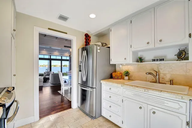 a living room with furniture and large windows
