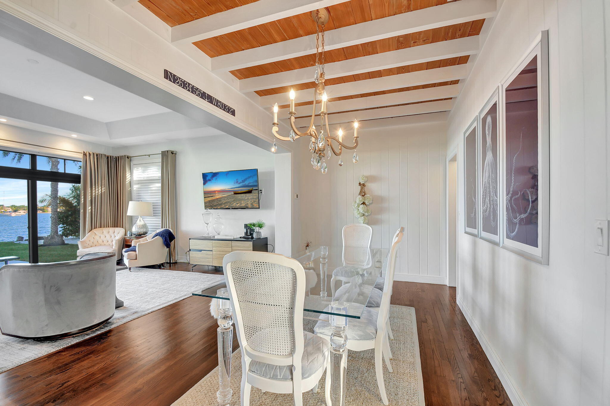 310 South Lake Drive Lantana, FL 33462 - Photo 18 of 65 a view of a dining room with furniture wooden floor and chandelier
