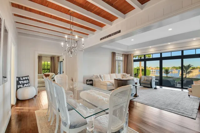 a bedroom with a bed wooden floor and window