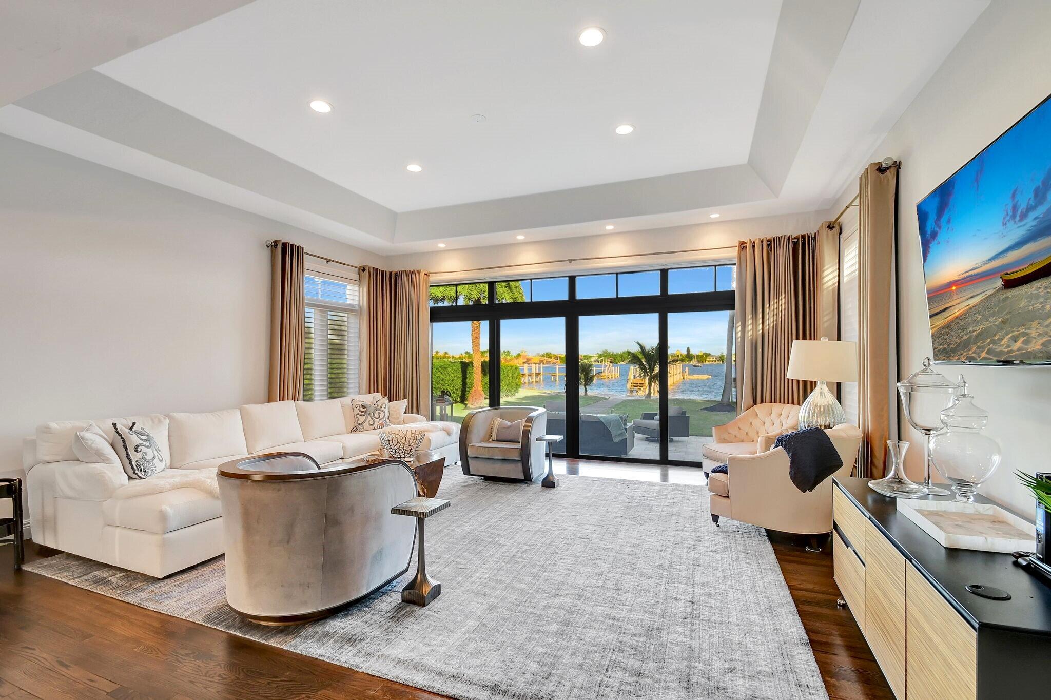 310 South Lake Drive Lantana, FL 33462 - Photo 20 of 65 a living room with furniture and large windows