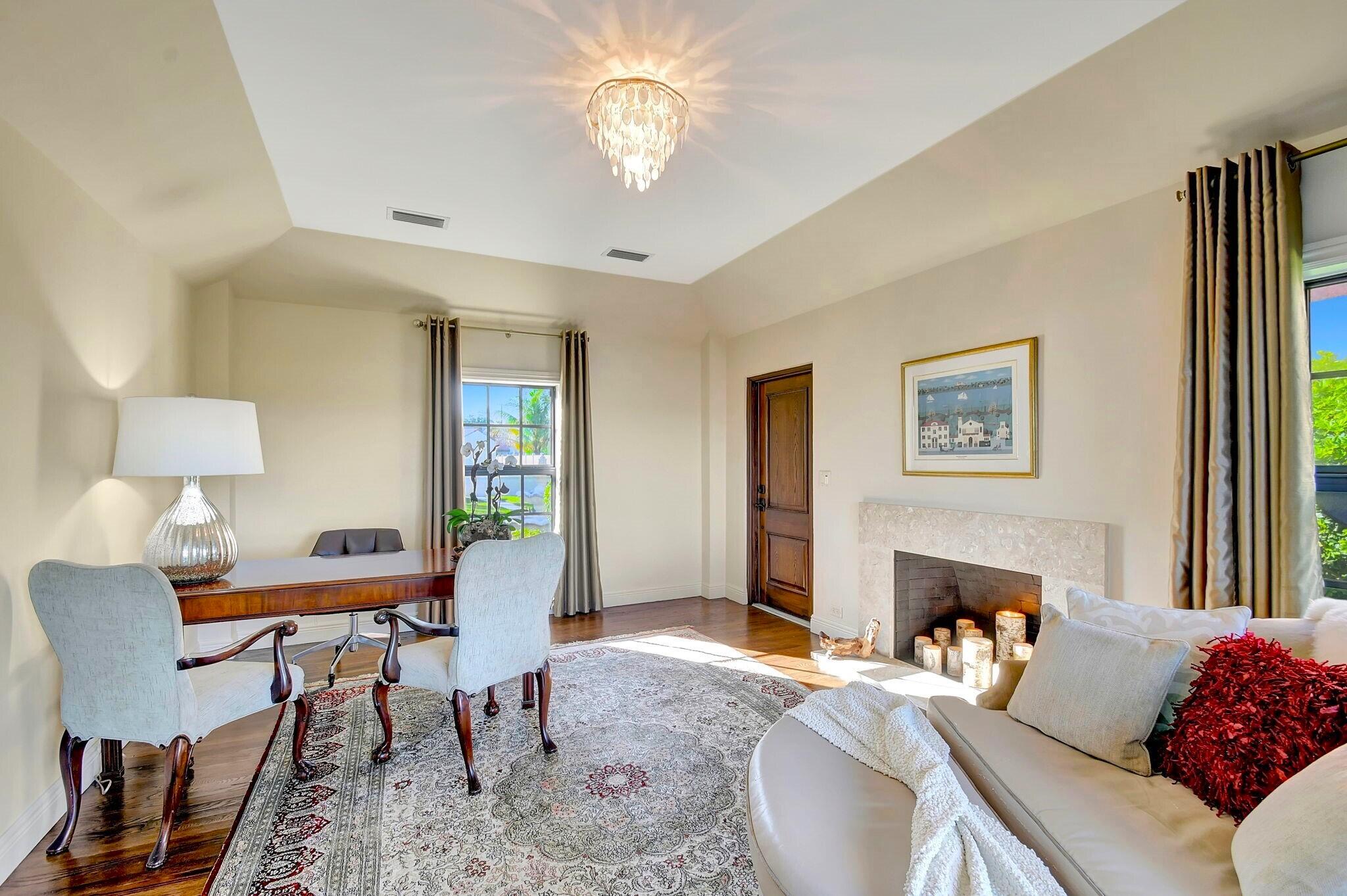 310 South Lake Drive Lantana, FL 33462 - Photo 29 of 65 a living room with furniture and a fireplace