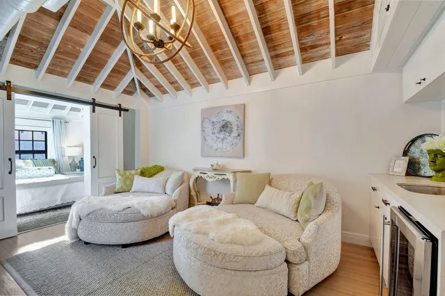 a bathroom with a granite countertop sink mirror vanity and a toilet