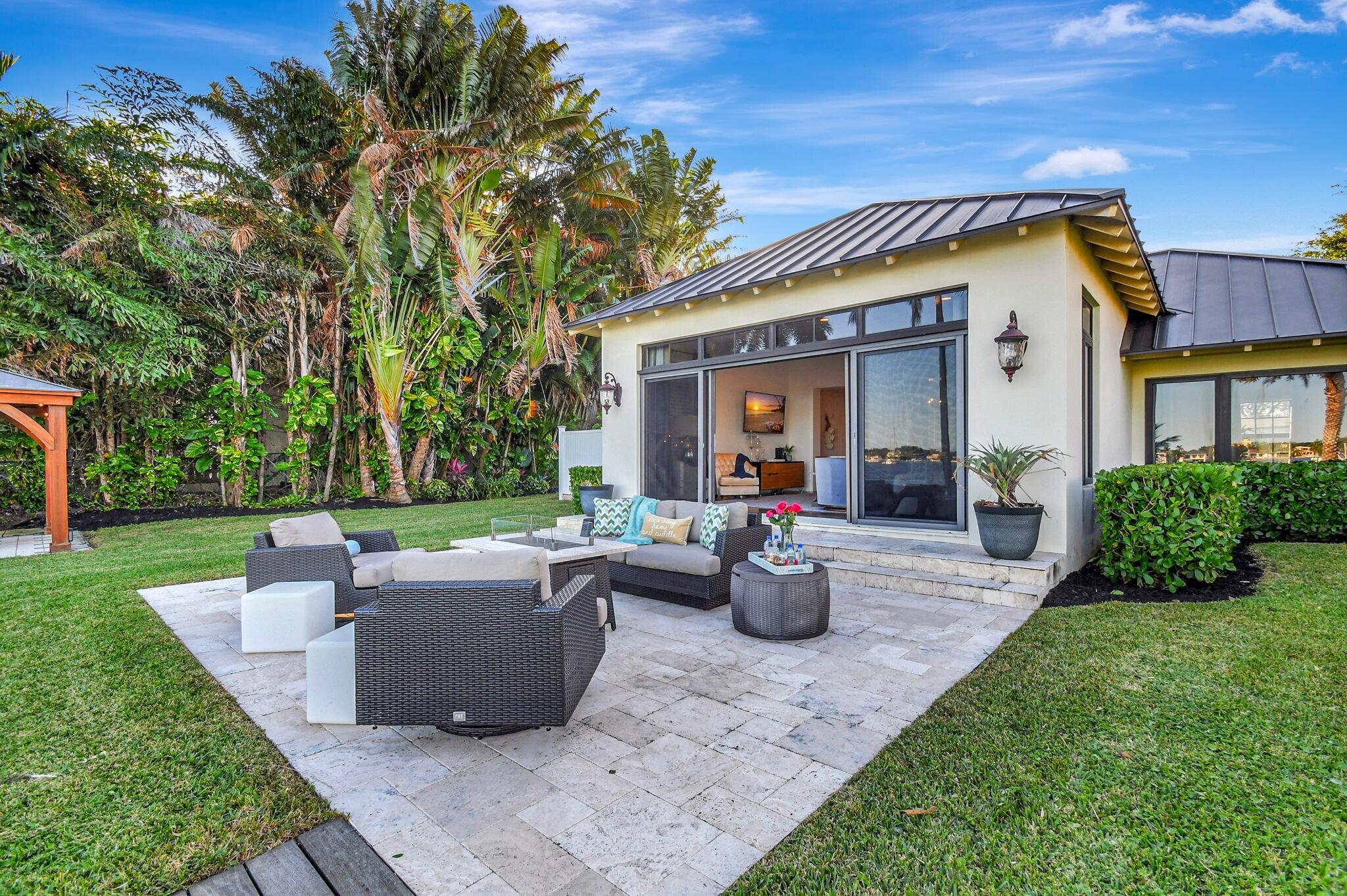 310 South Lake Drive Lantana, FL 33462 - Photo 41 of 65 a view of a house with backyard and sitting area