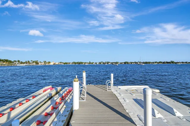 an aerial view of residential houses with outdoor space and street view