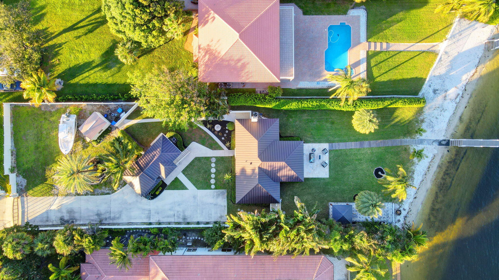 310 South Lake Drive Lantana, FL 33462 - Photo 58 of 65 an aerial view of a house with a yard and a large tree