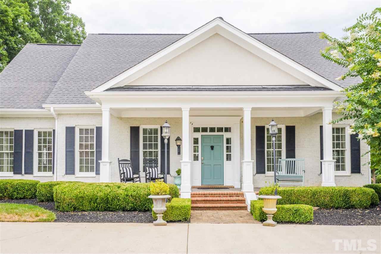 1005 Oak Creek Road Raleigh, NC 27615 - Photo 1 of 30 front view of a house with a patio