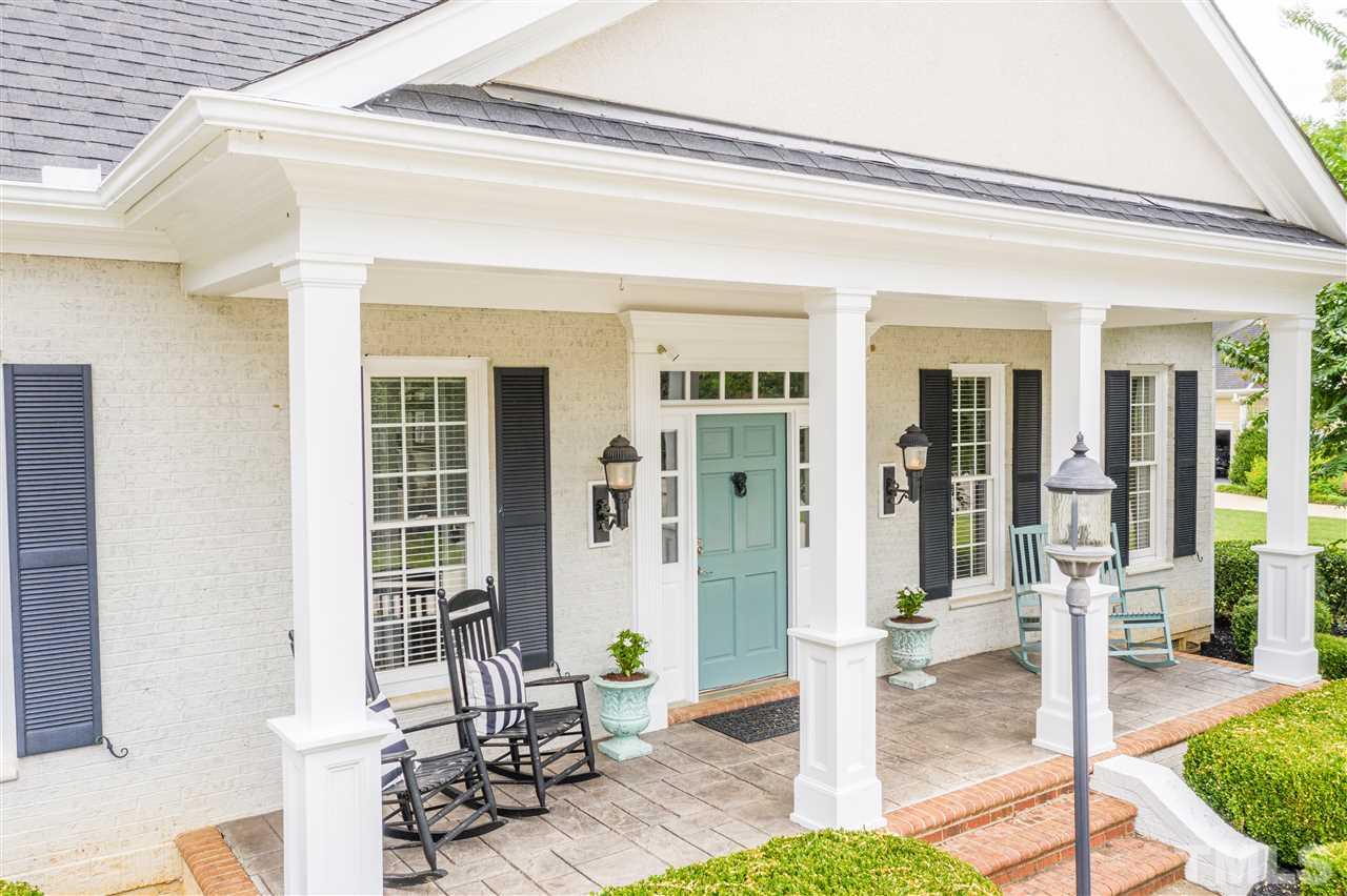 1005 Oak Creek Road Raleigh, NC 27615 - Photo 2 of 30 a front view of a house with outdoor seating