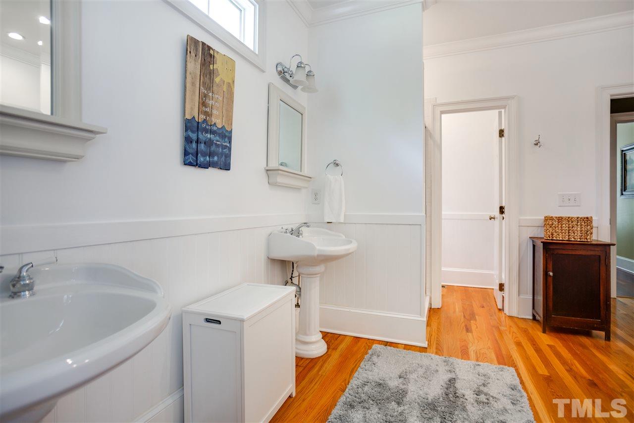 1005 Oak Creek Road Raleigh, NC 27615 - Photo 13 of 30 a bathroom with a sink and a mirror