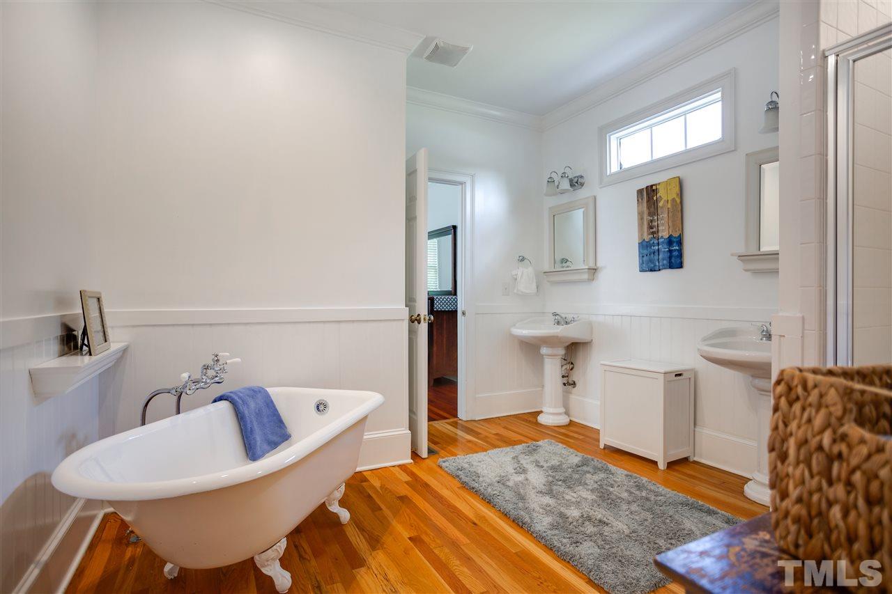 1005 Oak Creek Road Raleigh, NC 27615 - Photo 14 of 30 a bedroom with a bed and wooden floor