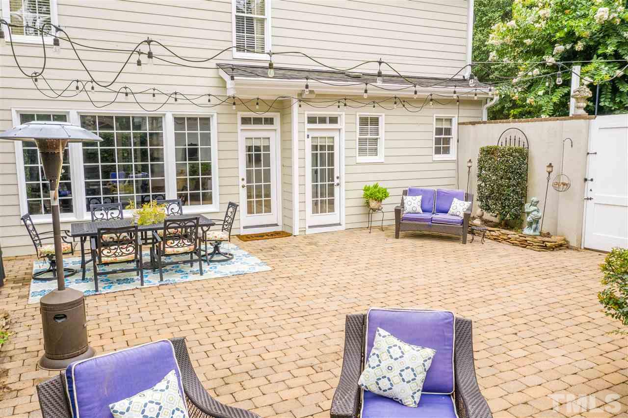 1005 Oak Creek Road Raleigh, NC 27615 - Photo 24 of 30 a building outdoor space with patio furniture