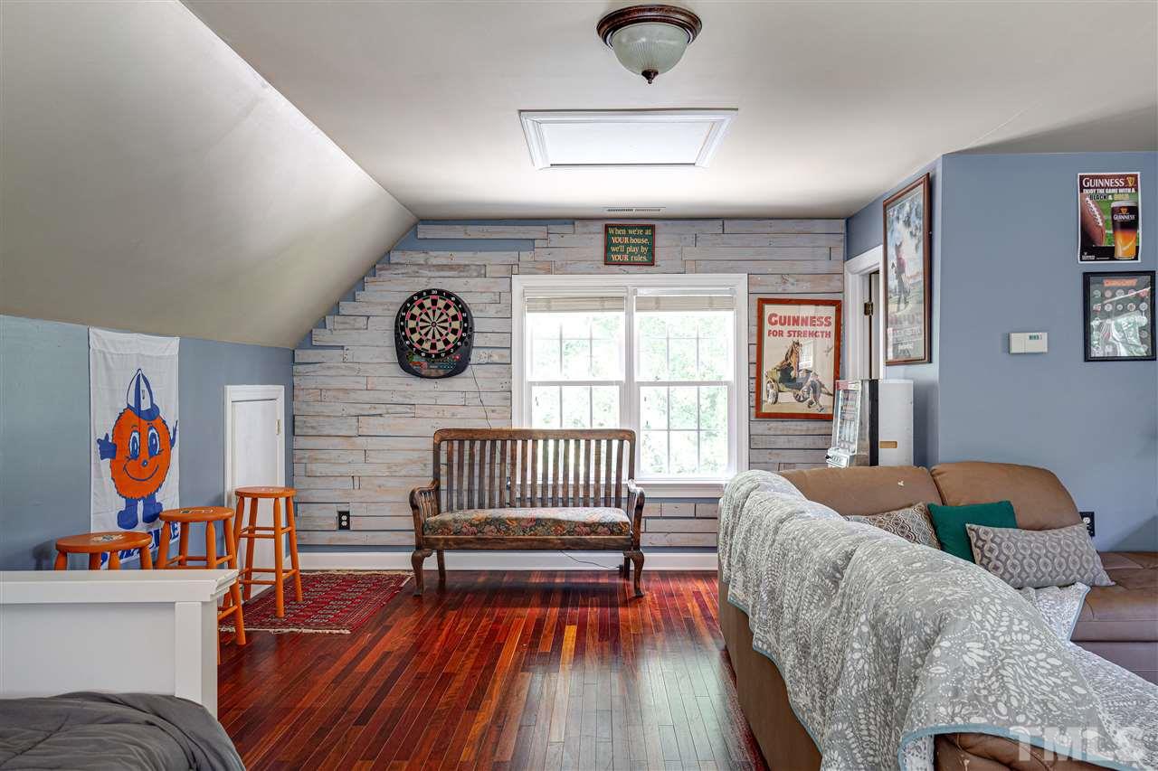 1005 Oak Creek Road Raleigh, NC 27615 - Photo 27 of 30 a bedroom with furniture and a window