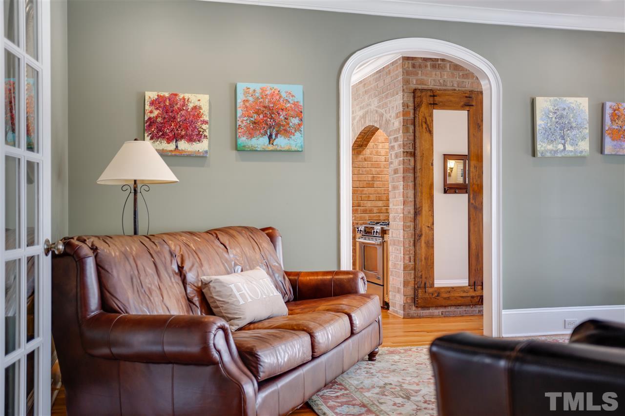 1005 Oak Creek Road Raleigh, NC 27615 - Photo 6 of 30 a living room with furniture and a couch