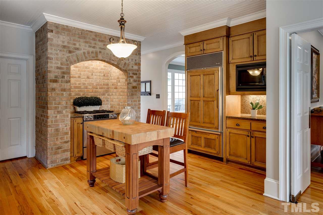 1005 Oak Creek Road Raleigh, NC 27615 - Photo 8 of 30 a view of a dining room with furniture window and wooden floor
