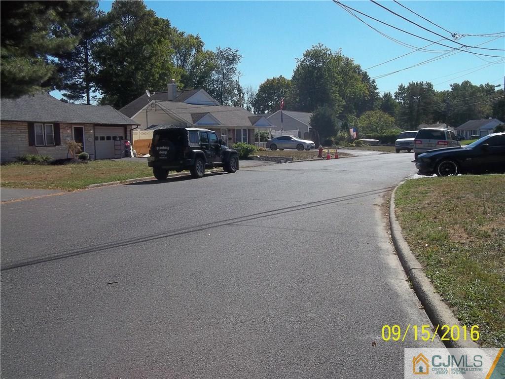22 Knollwood Road Edison, NJ 08817 - Photo 22 of 24 a car parked in front of house
