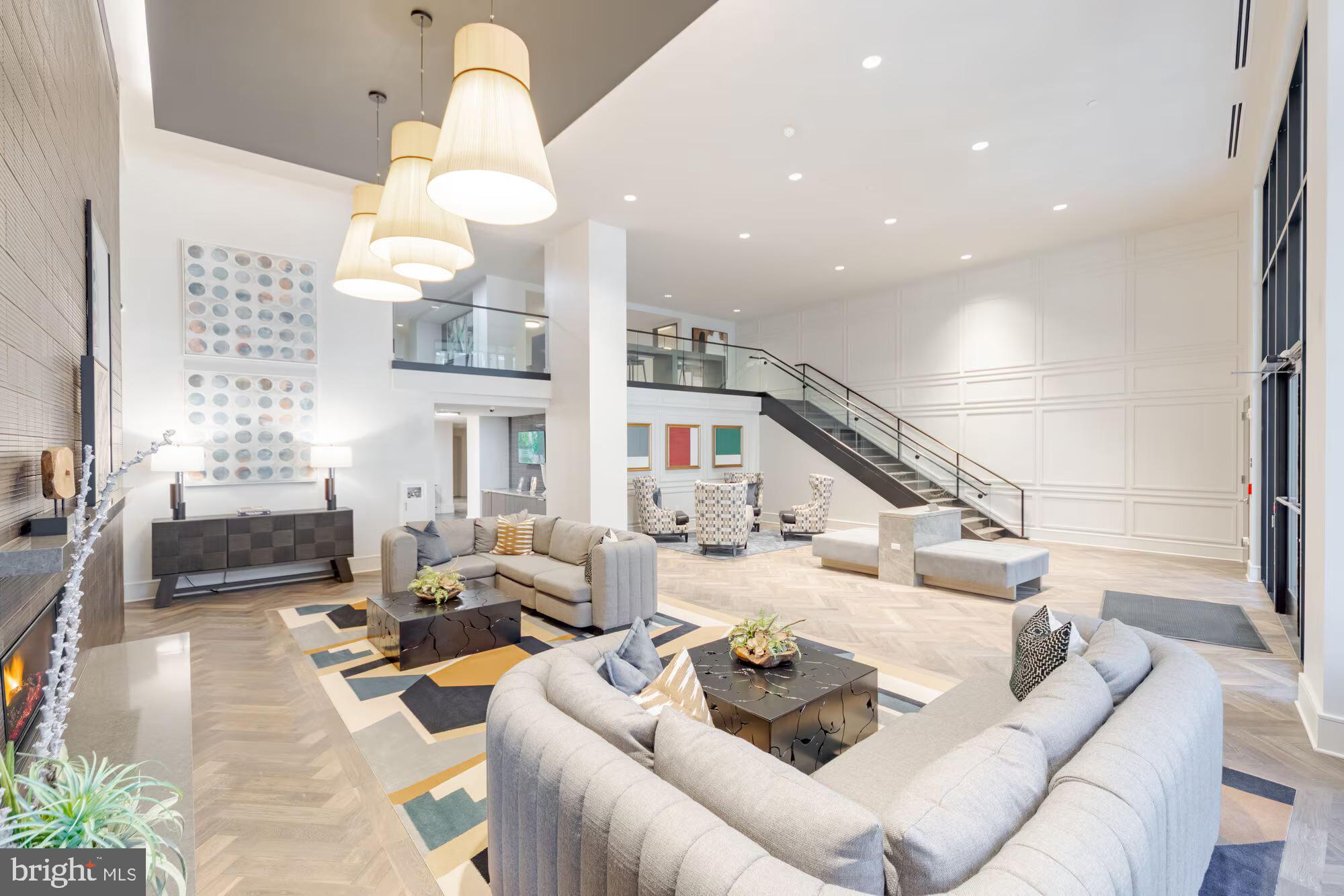 501-31 North Christopher Columbus Boulevard, Unit 2313 Philadelphia, PA 19123 - Photo 36 of 38 a living room with furniture fireplace and a table