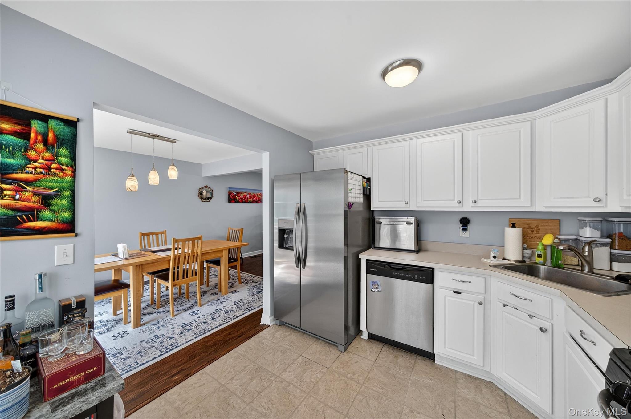 1 Lake Ridge Drive Middletown, NY 10940 - Photo 16 of 44 a kitchen with stainless steel appliances granite countertop a refrigerator and a stove top oven