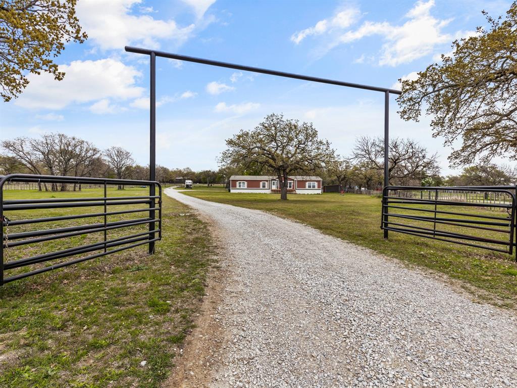 831 Cool Junction Millsap, TX 76066 - Photo 1 of 1 a view of a road with a yard
