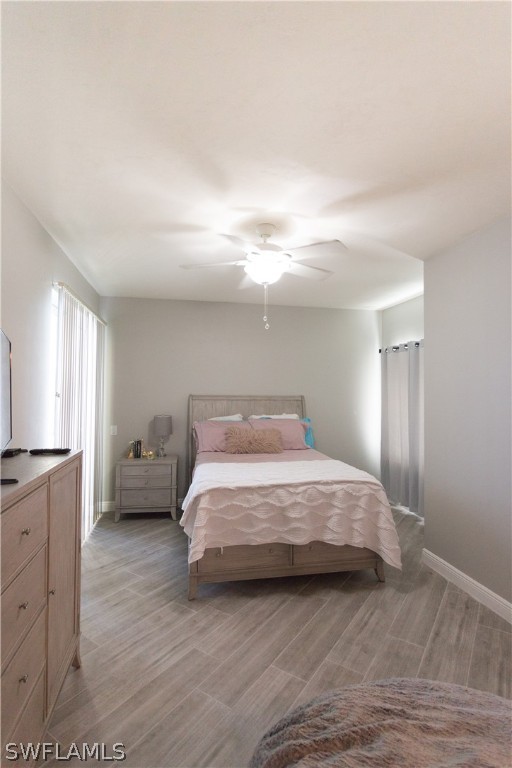 2745 First Street, Unit 1306 Fort Myers, FL 33916 - Photo 11 of 34 a spacious bedroom with a bed and a cabinets