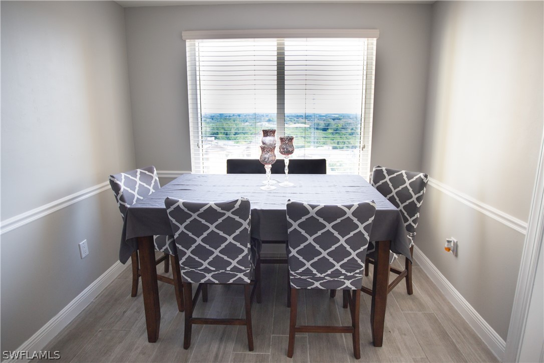 2745 First Street, Unit 1306 Fort Myers, FL 33916 - Photo 12 of 34 a view of a dining room with furniture window and outside view
