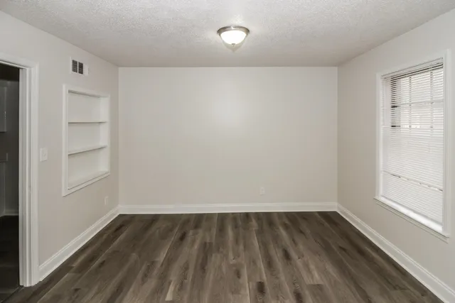 a view of wooden floor in an empty room