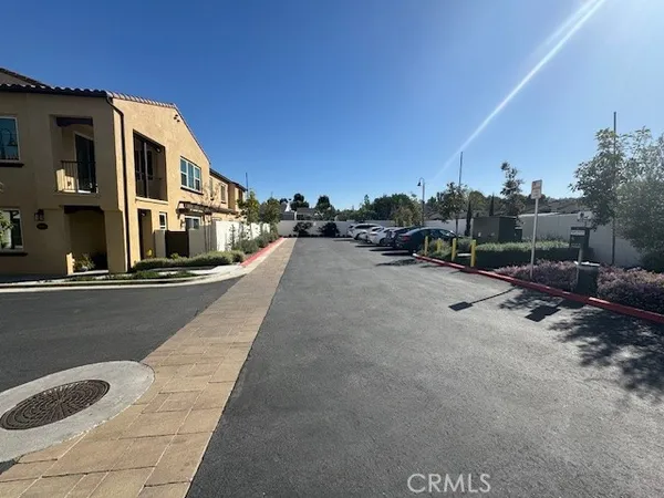 a view of a street with a building in the background