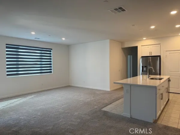 a view of kitchen with furniture and window