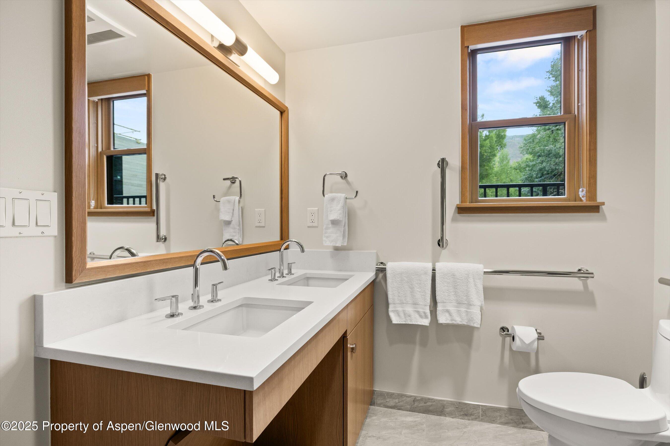 122 West Main Street Aspen, CO 81611 - Photo 17 of 58 a bathroom with a sink and a toilet