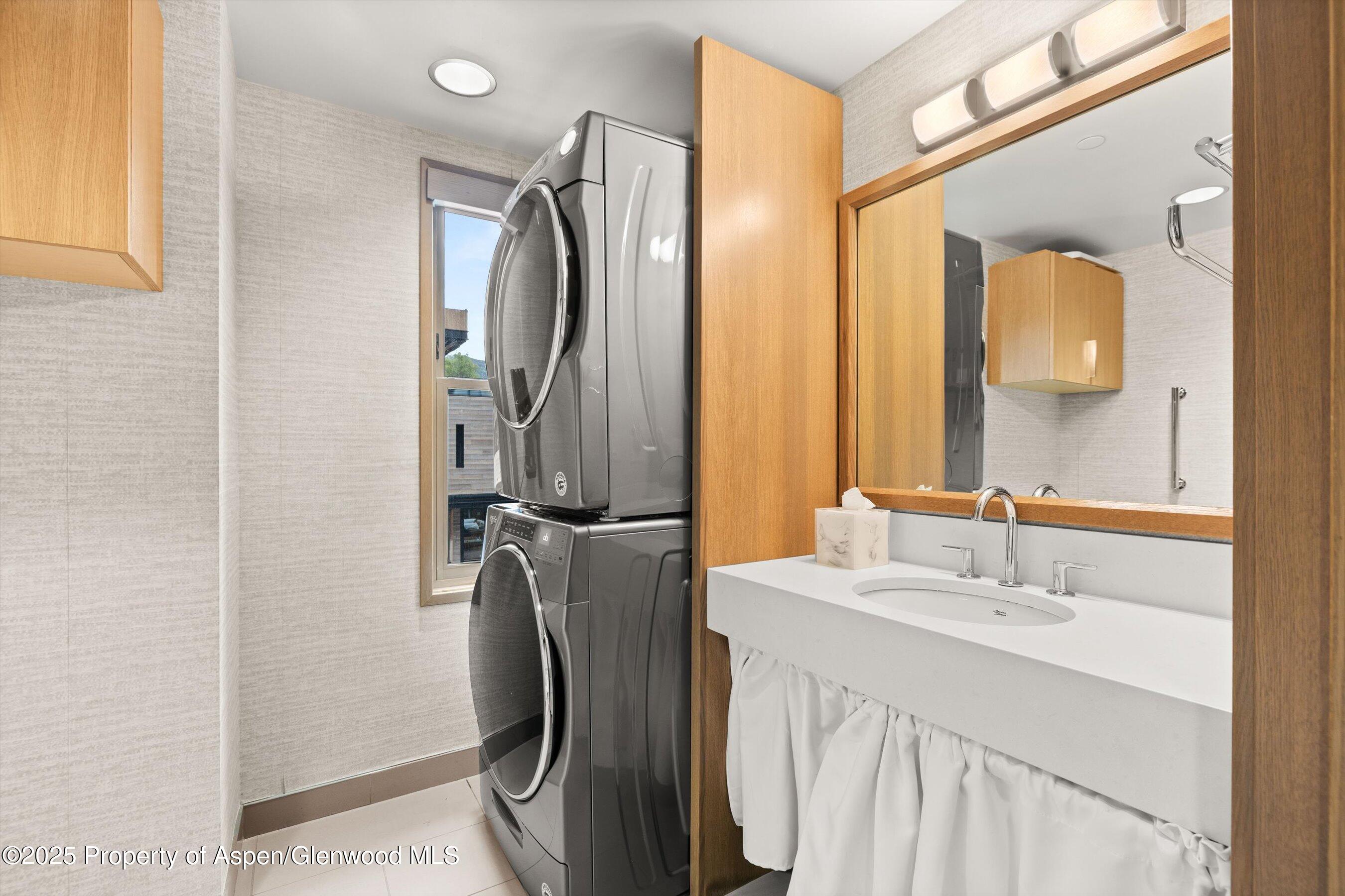 122 West Main Street Aspen, CO 81611 - Photo 19 of 58 a bathroom with a sink a vanity and a mirror