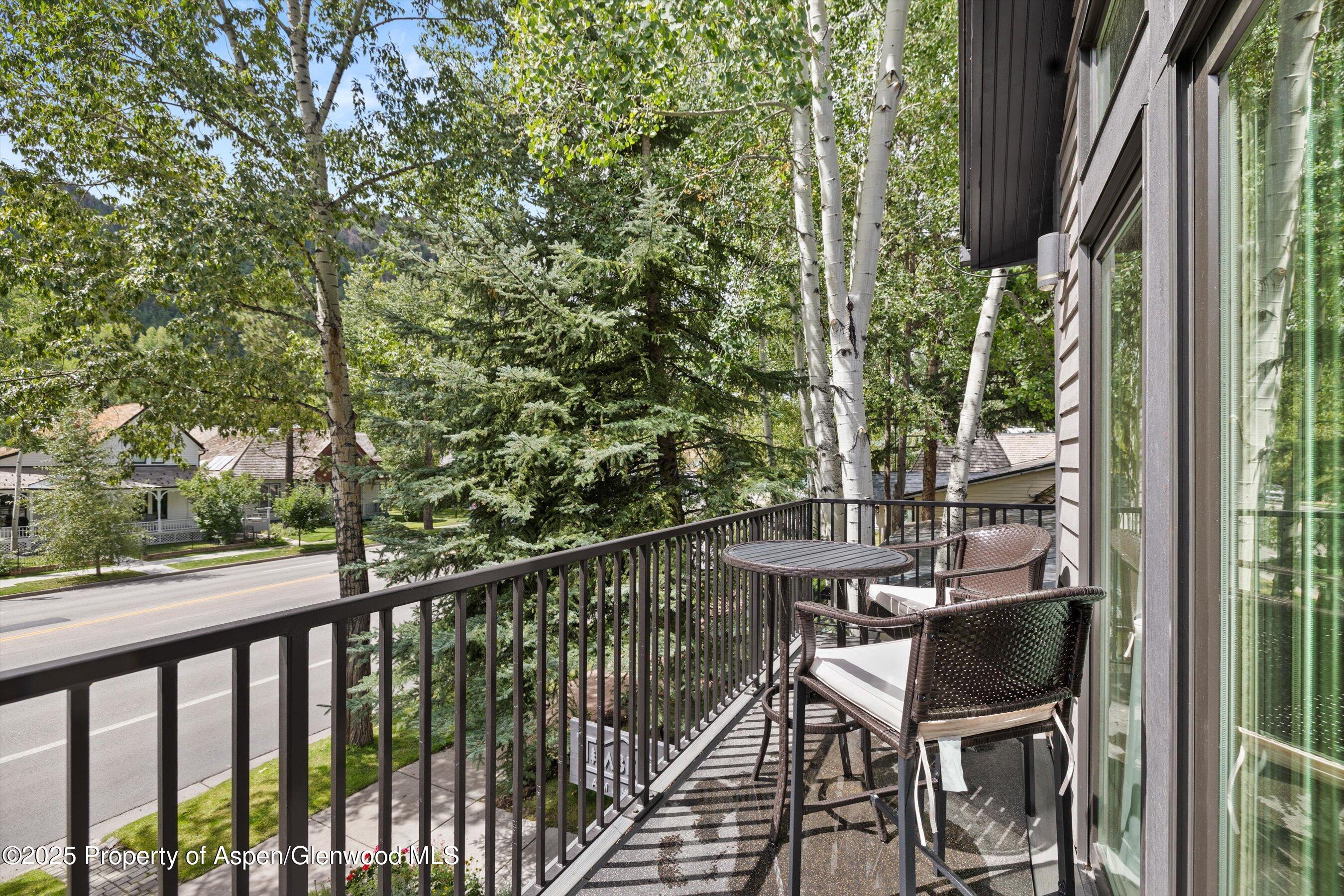 122 West Main Street Aspen, CO 81611 - Photo 27 of 58 a view of a balcony with chairs