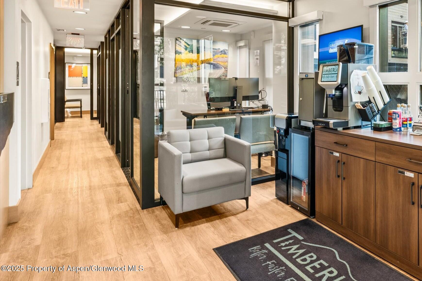 122 West Main Street Aspen, CO 81611 - Photo 30 of 58 a living room with furniture and a table