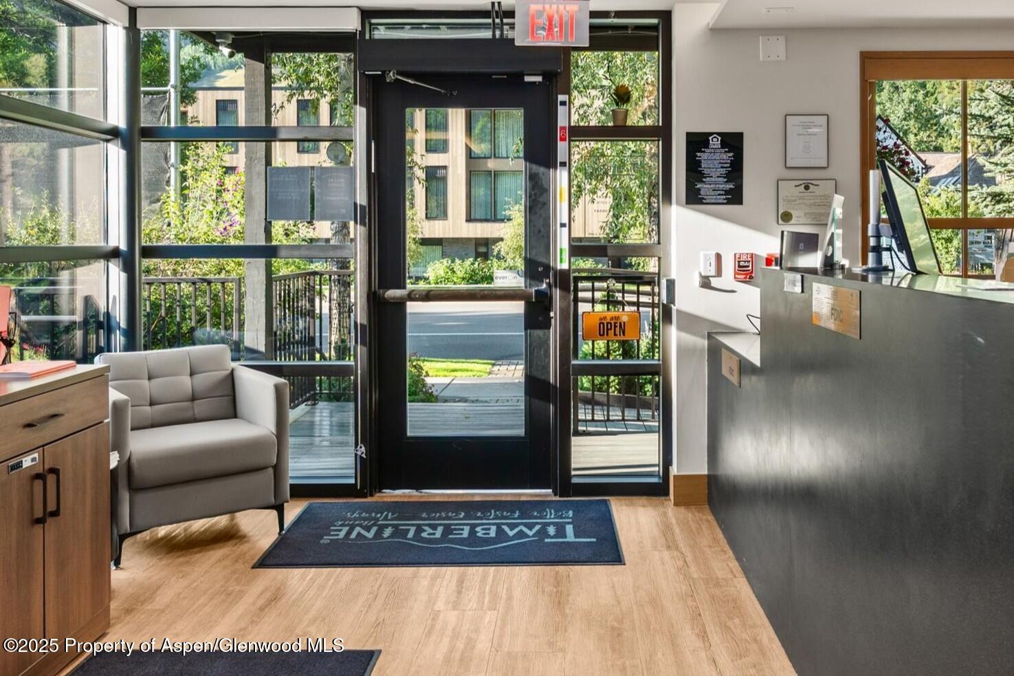 122 West Main Street Aspen, CO 81611 - Photo 32 of 58 a living room with furniture and a floor to ceiling window