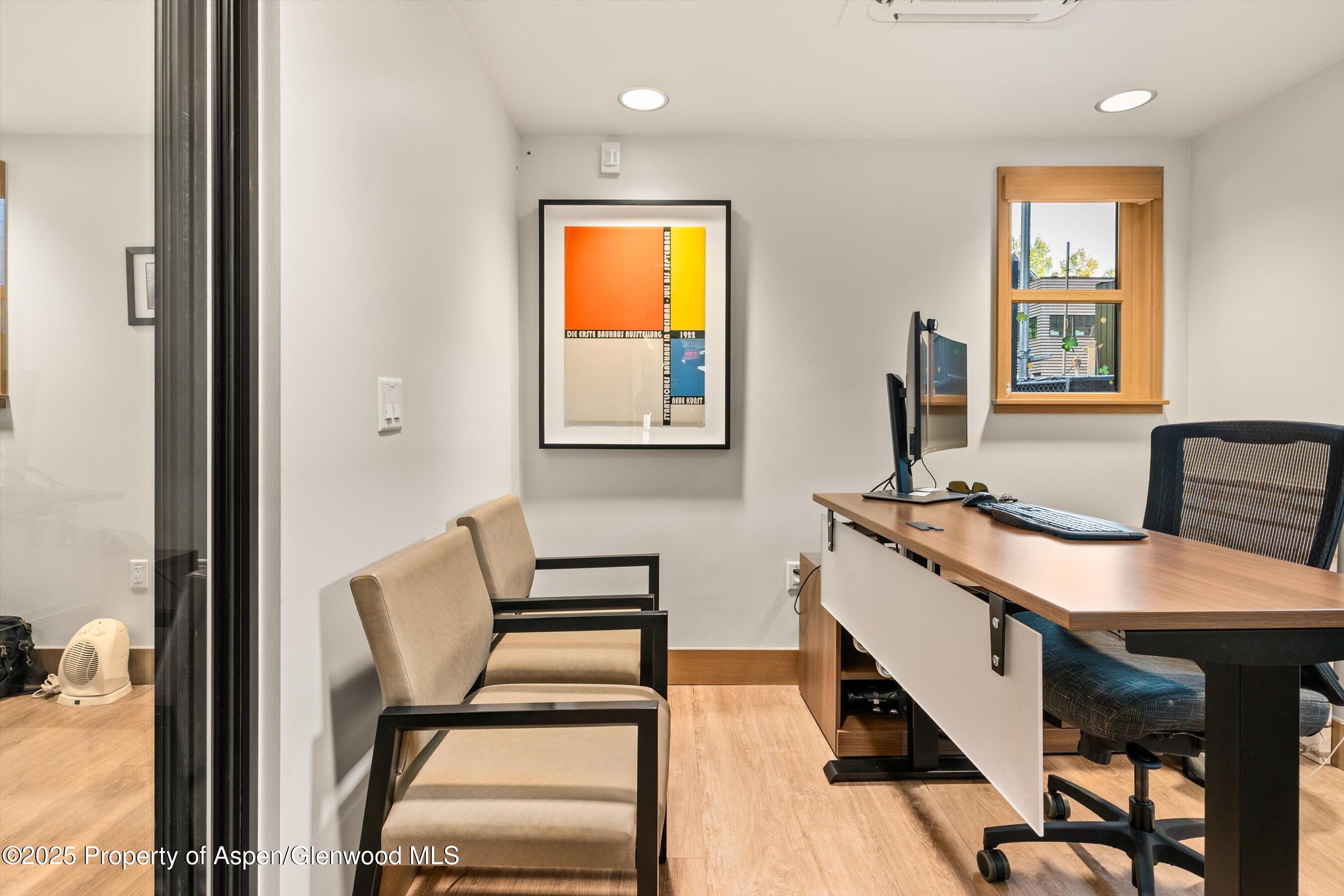 122 West Main Street Aspen, CO 81611 - Photo 38 of 58 a view of a workspace with furniture and window