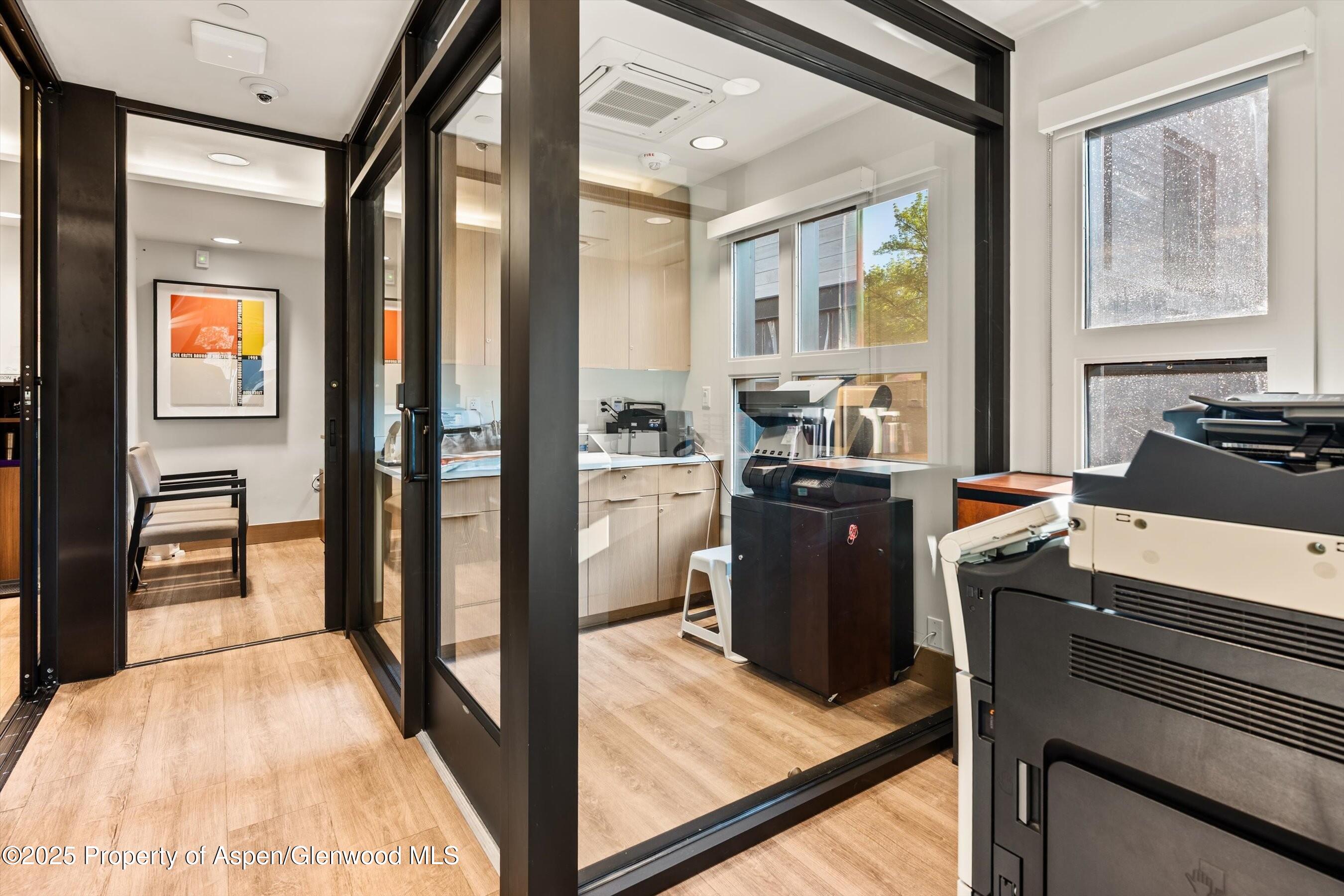 122 West Main Street Aspen, CO 81611 - Photo 46 of 58 a kitchen with a refrigerator and a stove