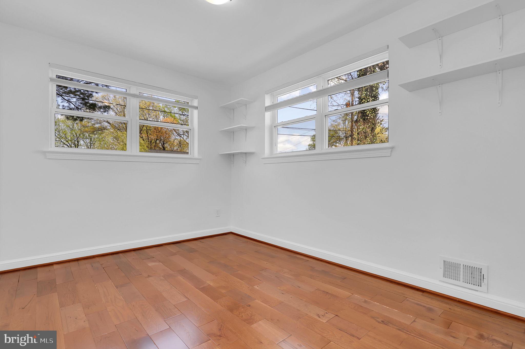 1009 Stirling Road Silver Spring, MD 20901 - Photo 14 of 33 an empty room with windows