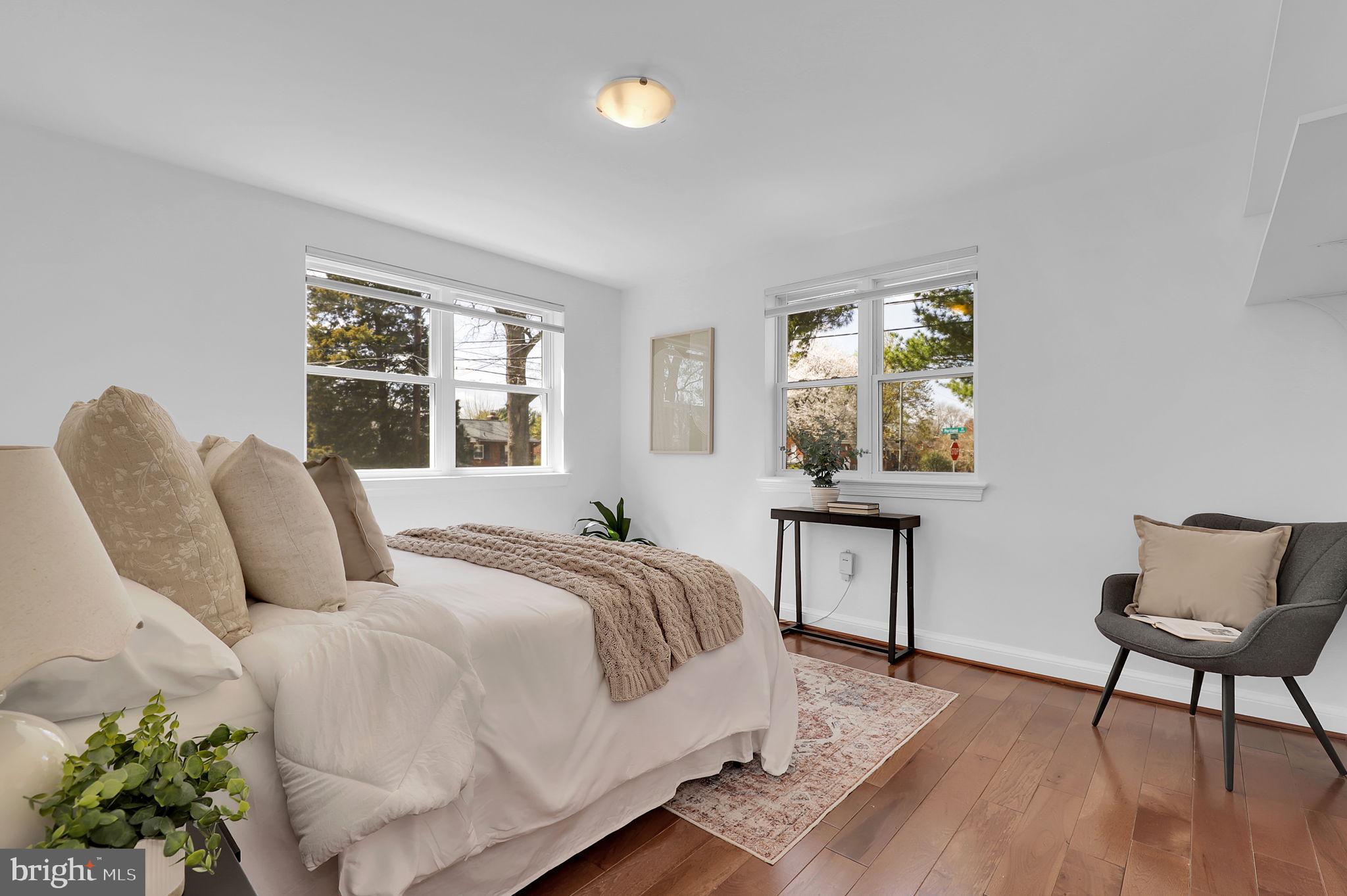 1009 Stirling Road Silver Spring, MD 20901 - Photo 16 of 33 a bedroom with a bed table chair and window