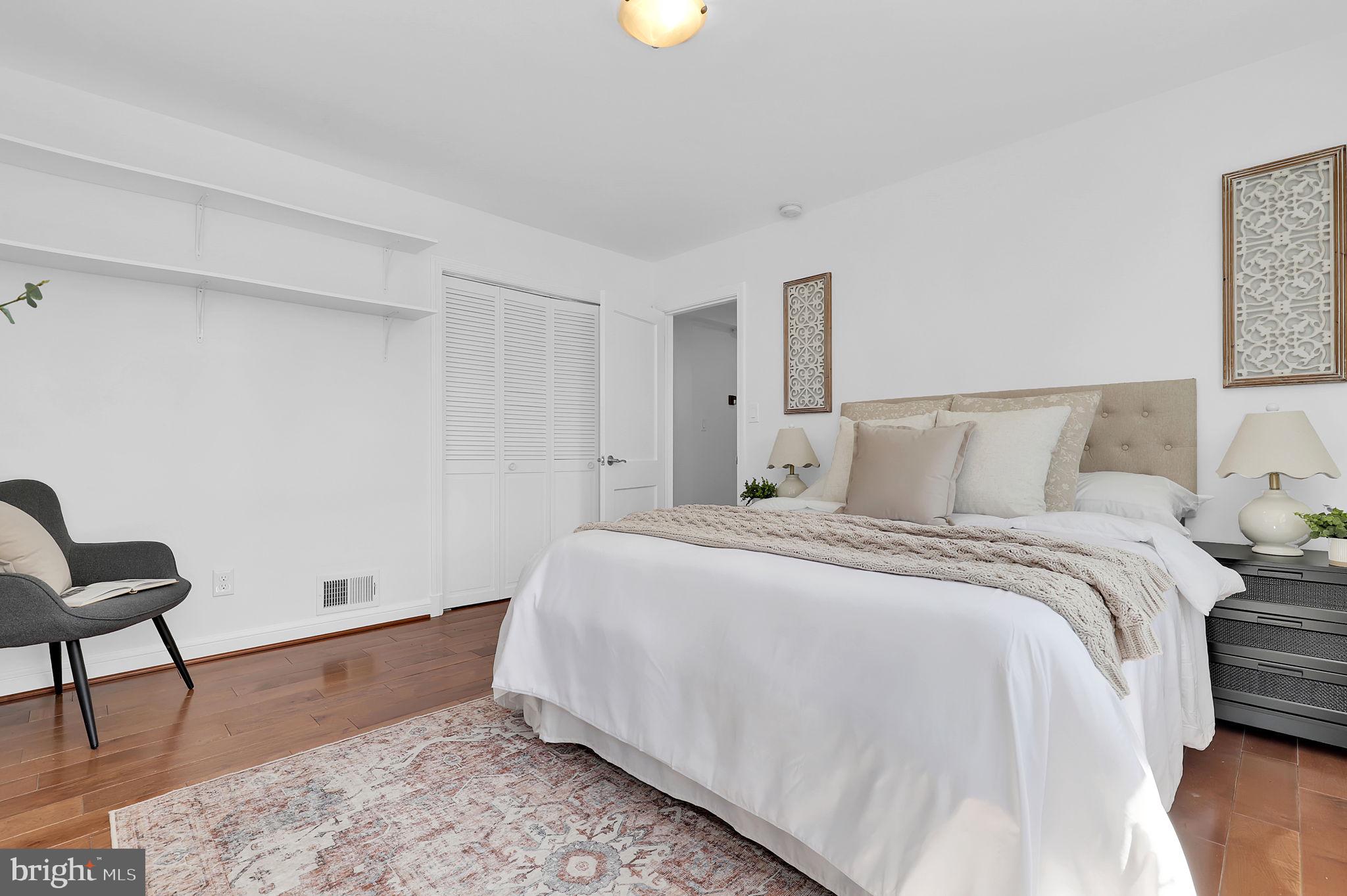 1009 Stirling Road Silver Spring, MD 20901 - Photo 17 of 33 a bedroom with a bed and chair