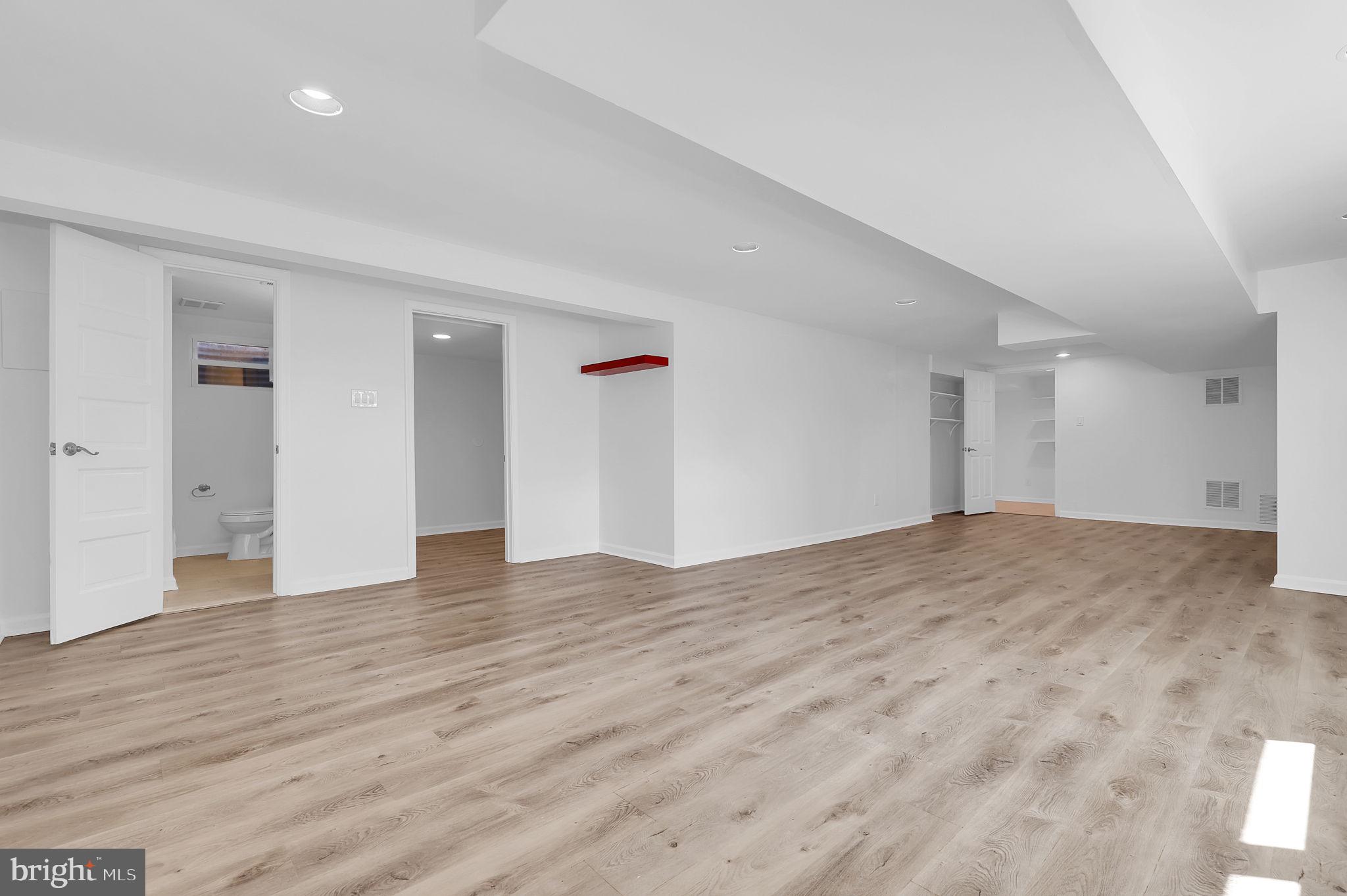 1009 Stirling Road Silver Spring, MD 20901 - Photo 19 of 33 a view of empty room with wooden floor