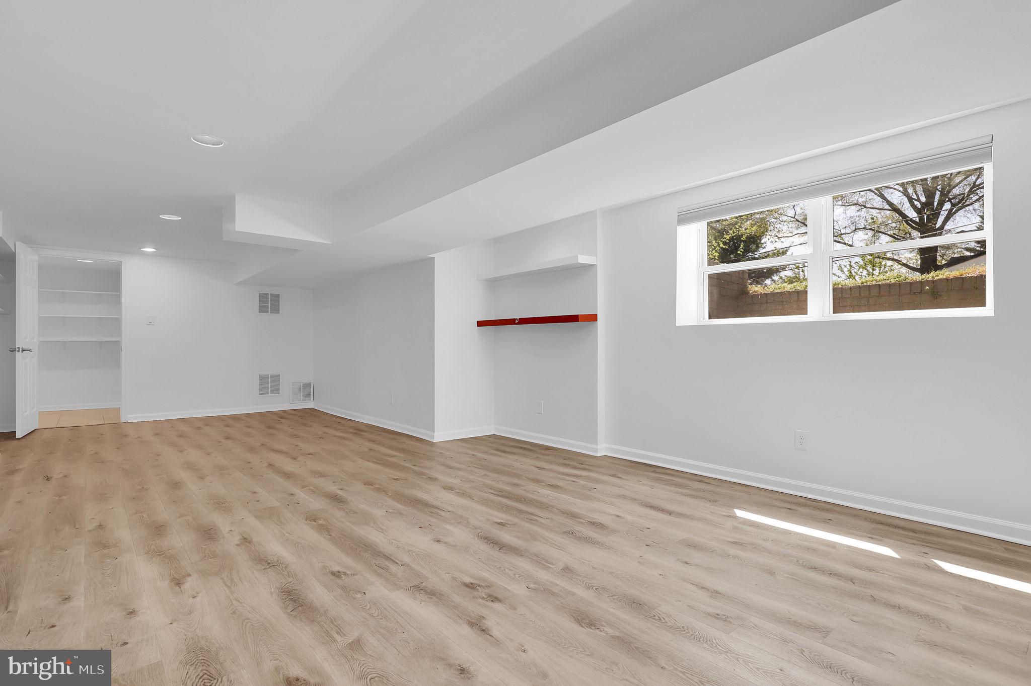 1009 Stirling Road Silver Spring, MD 20901 - Photo 20 of 33 a view of an empty room with a window