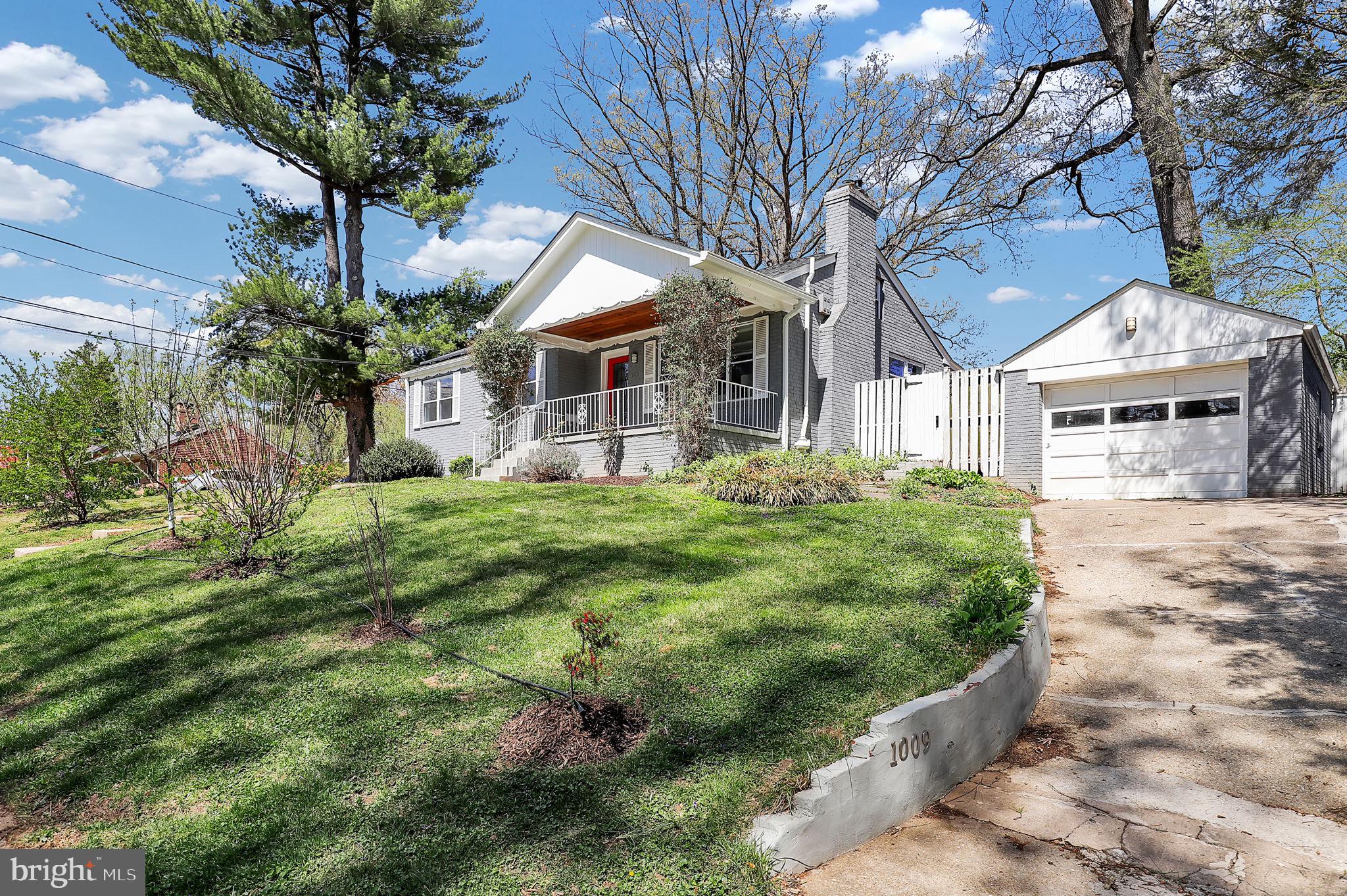 1009 Stirling Road Silver Spring, MD 20901 - Photo 2 of 33 a front view of a house with a garden