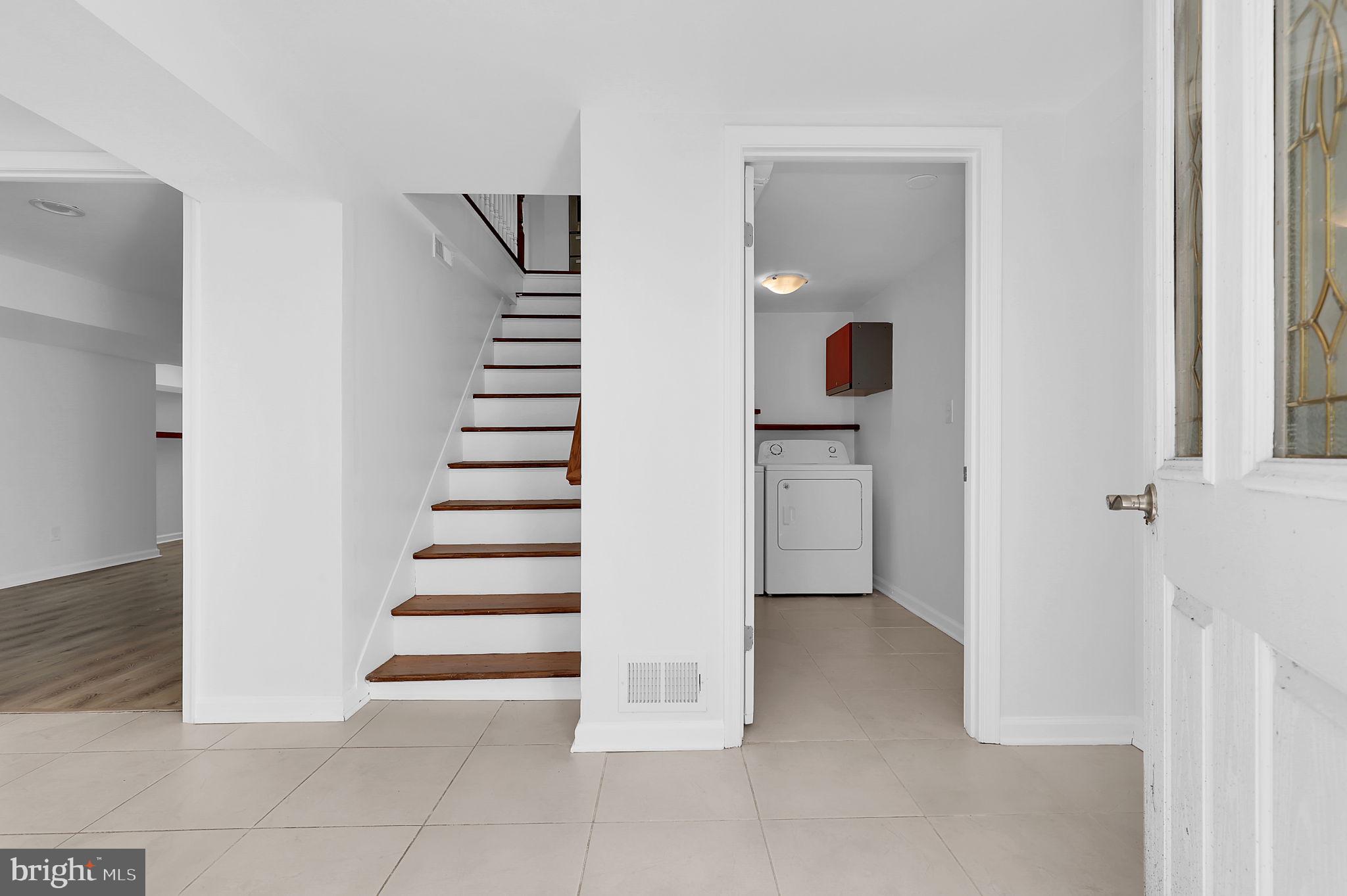 1009 Stirling Road Silver Spring, MD 20901 - Photo 25 of 33 a view of entryway and hall with wooden floor
