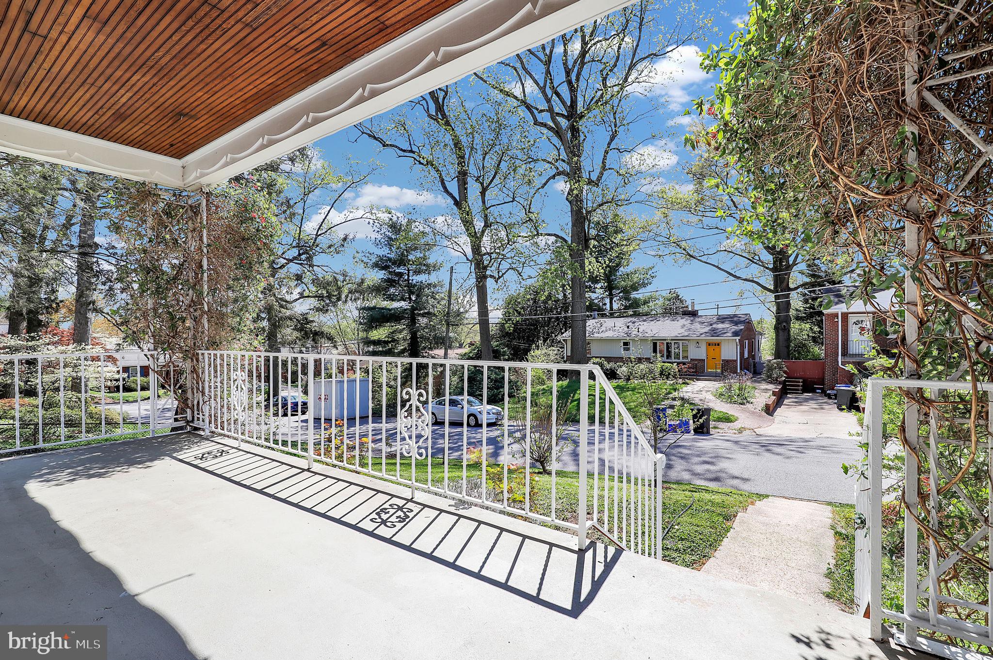 1009 Stirling Road Silver Spring, MD 20901 - Photo 26 of 33 a view of balcony with wooden floor and outdoor seating